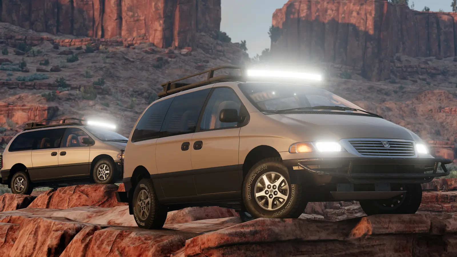 Concept artwork: two vans crawling over red rock